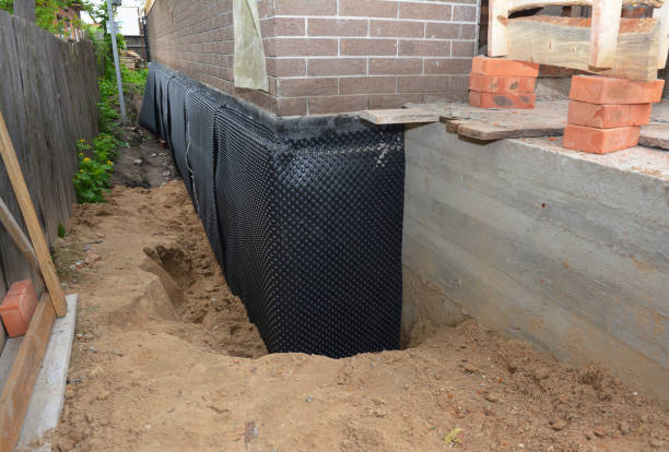SJ Waterproofing Pros technician performing targeted Wet Basement Repair assessment in Brentwood, PA